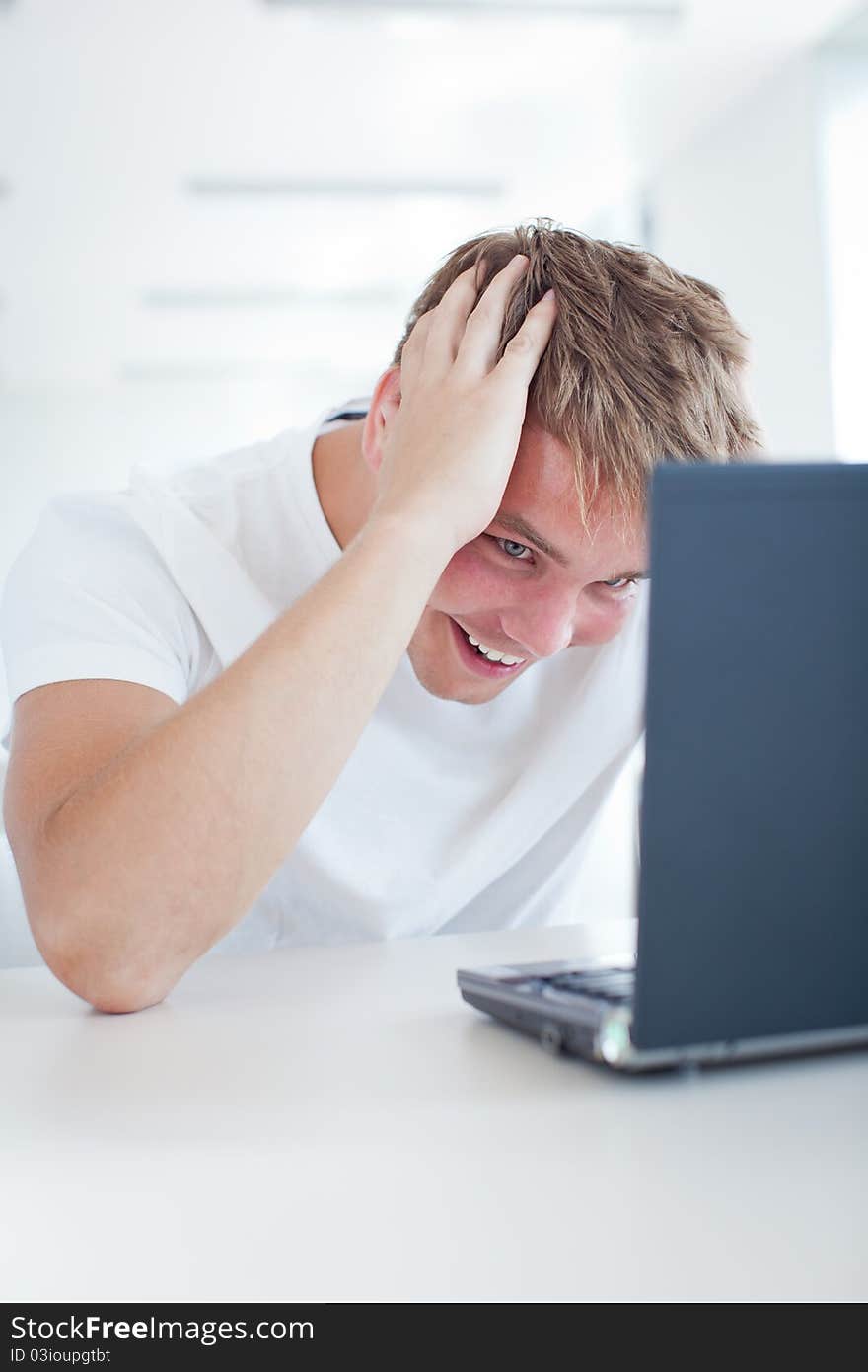 Student With Laptop Computer In  Library