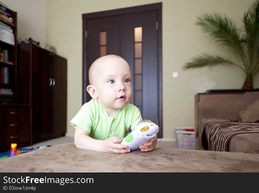 Sweet funny little baby dreamer at home