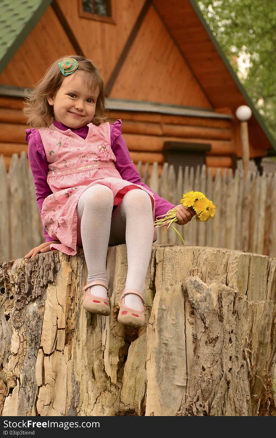 Beautiful girl with dandelions