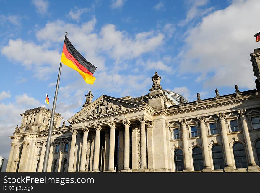 Front view of the Reichstag with german flags