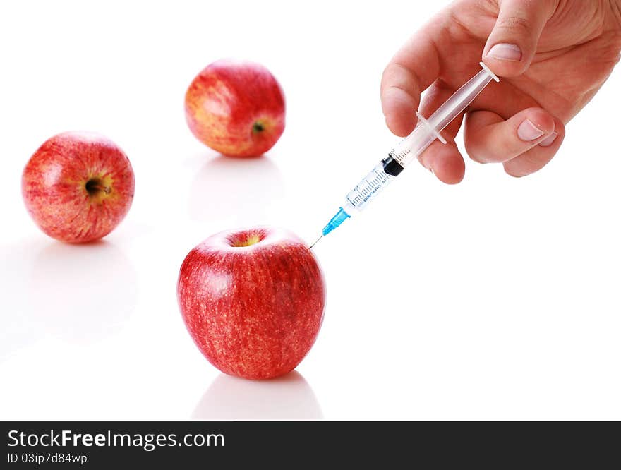 Apple and syringe