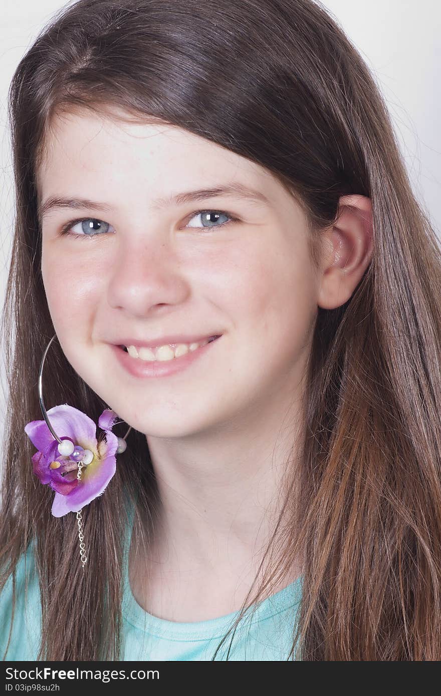 Young 11 year old girl with trendy flower earring. Young 11 year old girl with trendy flower earring