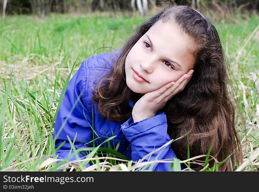 Portrait of the girl Against green wood. Portrait of the girl Against green wood