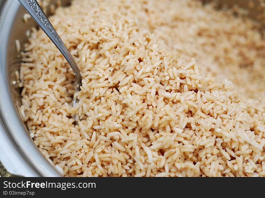 Large portion of glutinouos rice in pot, washed and seasoned for cooking. Large portion of glutinouos rice in pot, washed and seasoned for cooking.