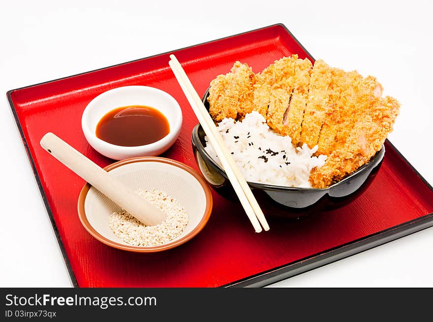 Rice and fried pork cutlet on whit background