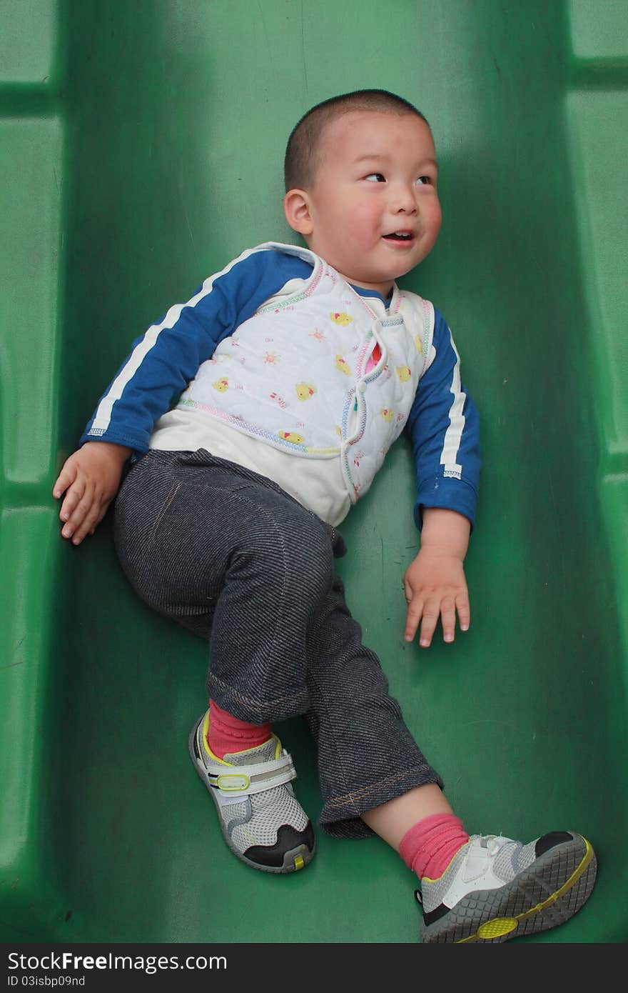 Chinese funny kid play in the park