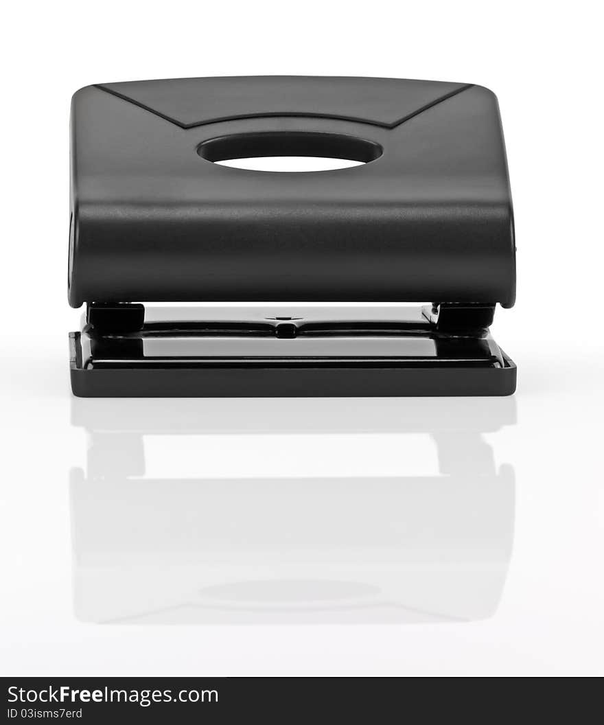 Black office hole punch on a white background