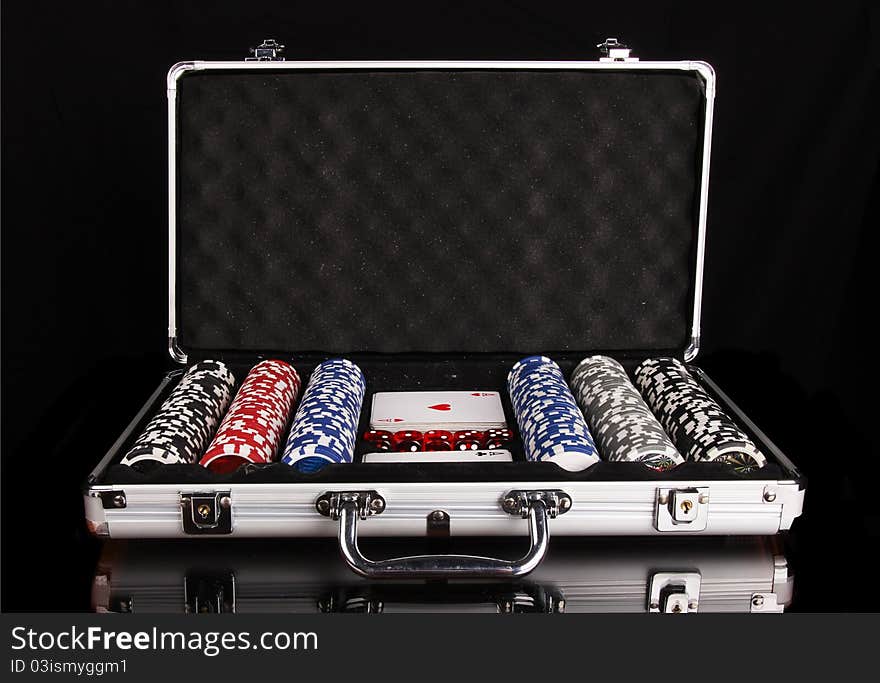 Poker equipment in case, isolated on black background