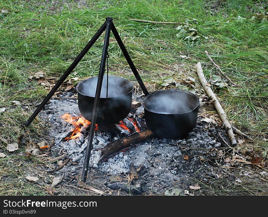 Preparing touristy food on campfire in wild camping. Preparing touristy food on campfire in wild camping