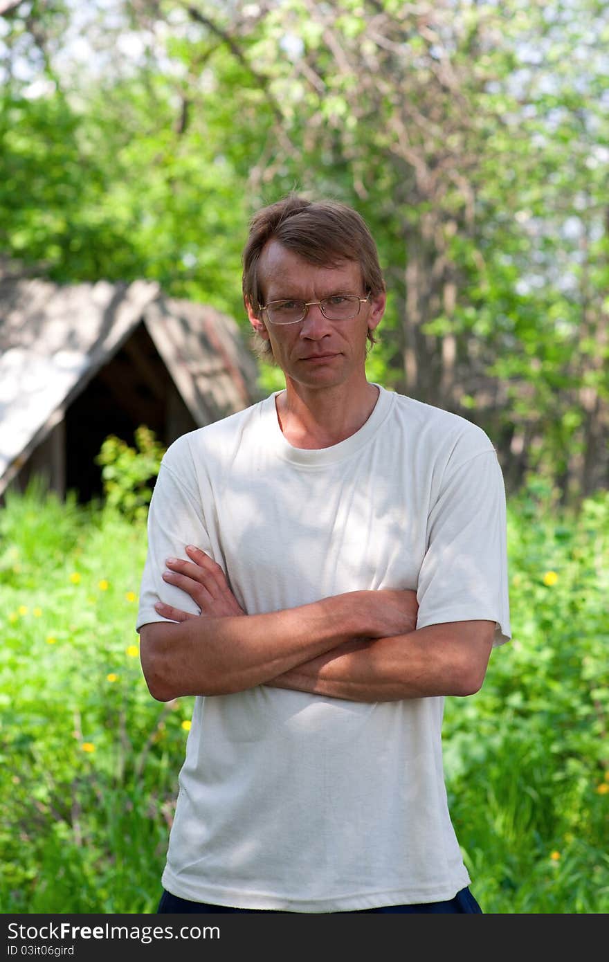 Portrait of the thin man in a kitchen garden