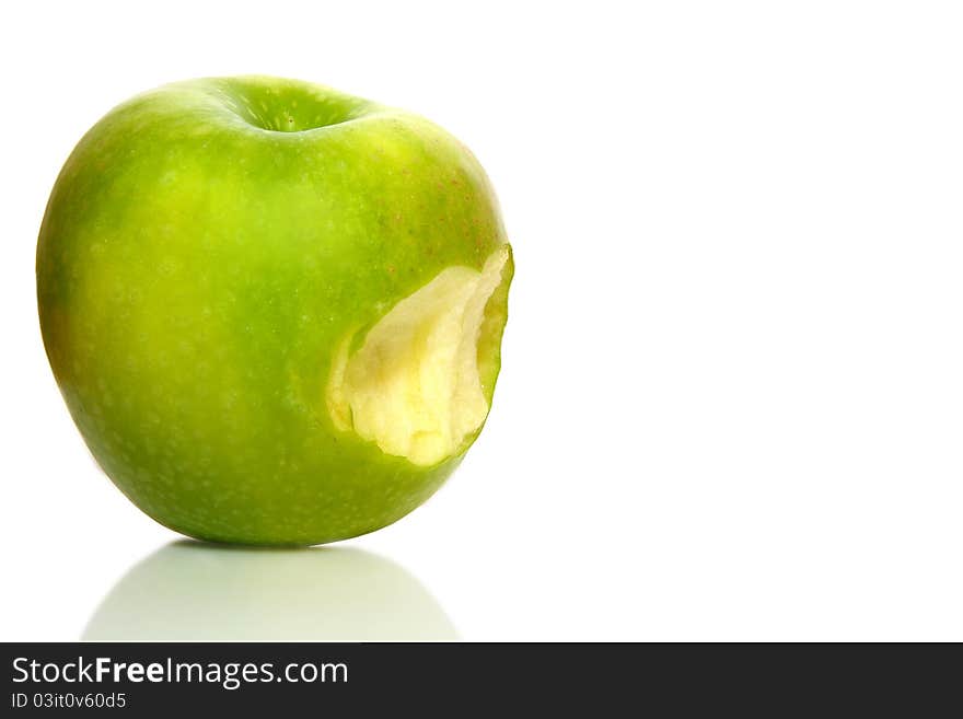 Fresh apple on isolated white background. Organic, healthy bitten green apple