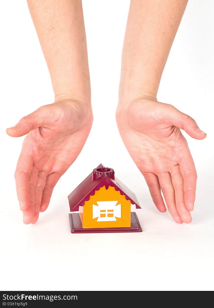 Hands and little house on white background