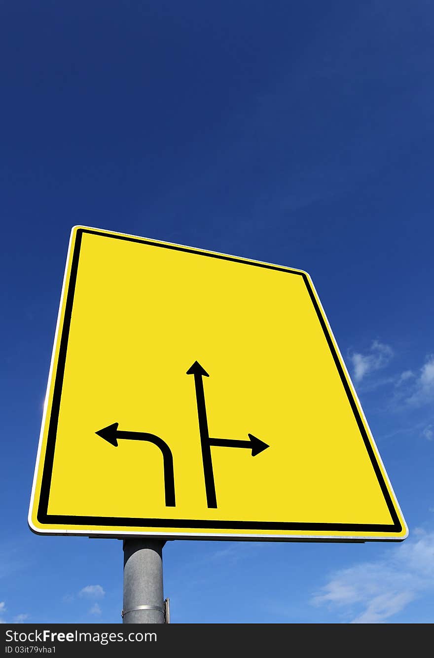 Textur-road sign under blue sky.