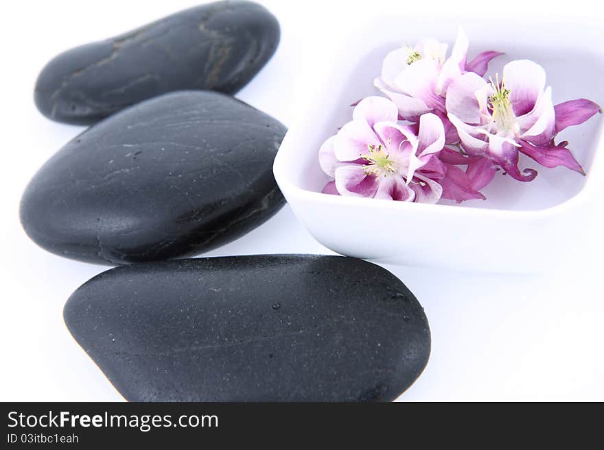 Spa stones and floating flower