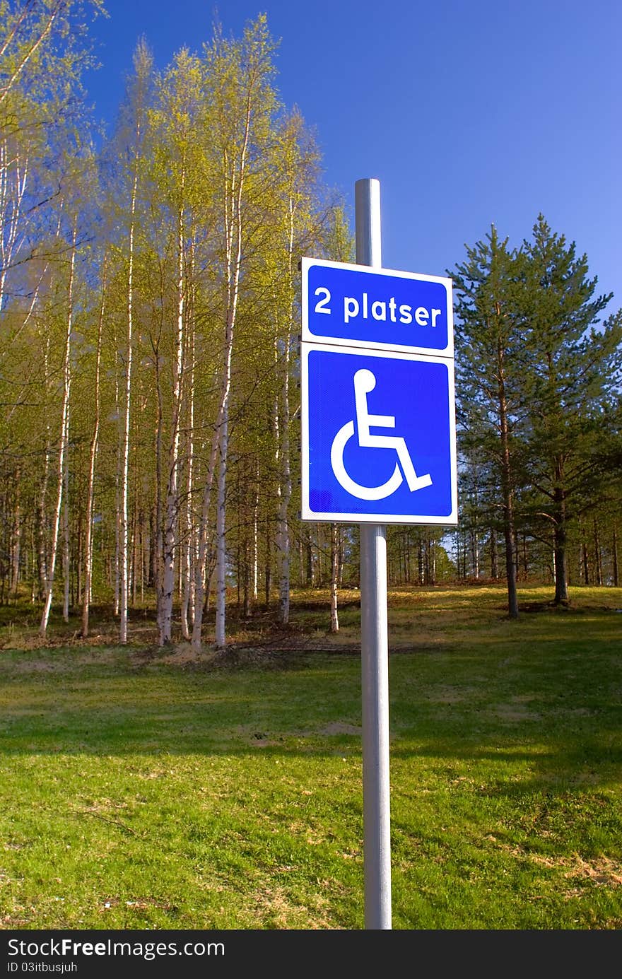 Disabled parking sign on the green park