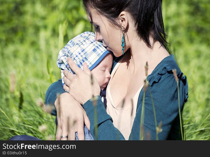 Happy and proud mother with her newborn baby. Happy and proud mother with her newborn baby