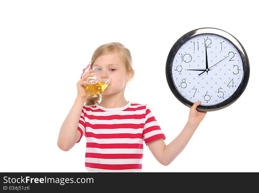 Girl with clock drinking juice from glass