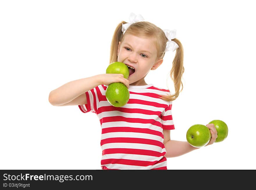 Girl bites dumbbell from apples isolated on white