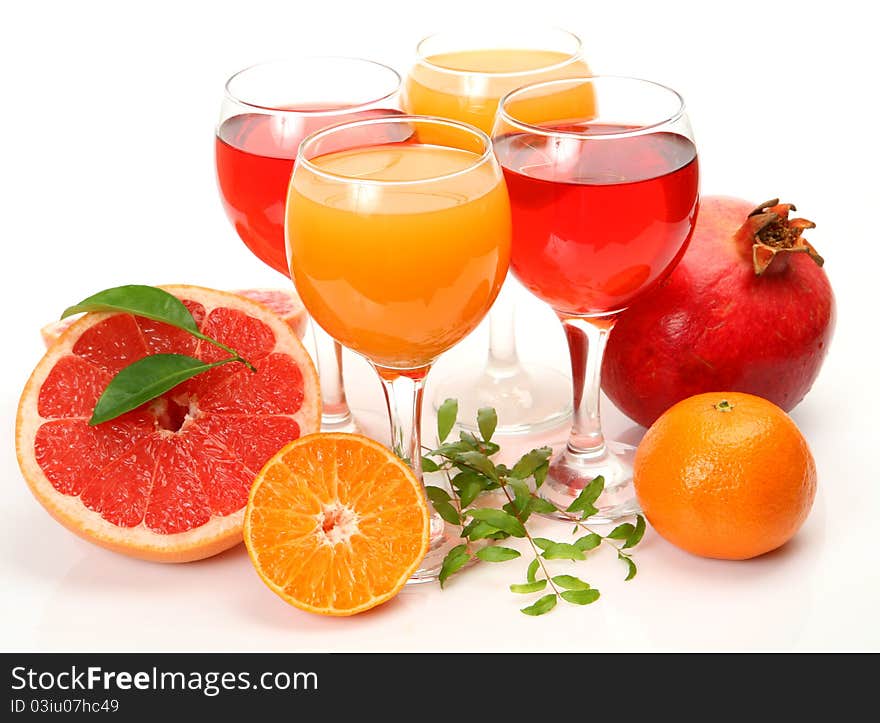 Fresh fruit and juice on a white background