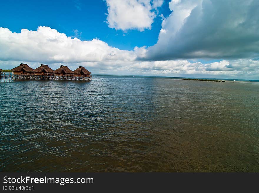 A resort of bungalows suspended on the water in the lagoon at Inhamabane, Mozambique. A resort of bungalows suspended on the water in the lagoon at Inhamabane, Mozambique