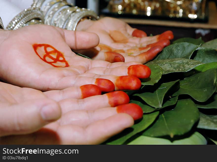 An indigenous traditional Indonesian Bugis ethnic marriages where the parents and elders give blessings by way of rubbing the betel leaf and brown sugar on the palms and sprinkle rice as a sign of blessing. An indigenous traditional Indonesian Bugis ethnic marriages where the parents and elders give blessings by way of rubbing the betel leaf and brown sugar on the palms and sprinkle rice as a sign of blessing