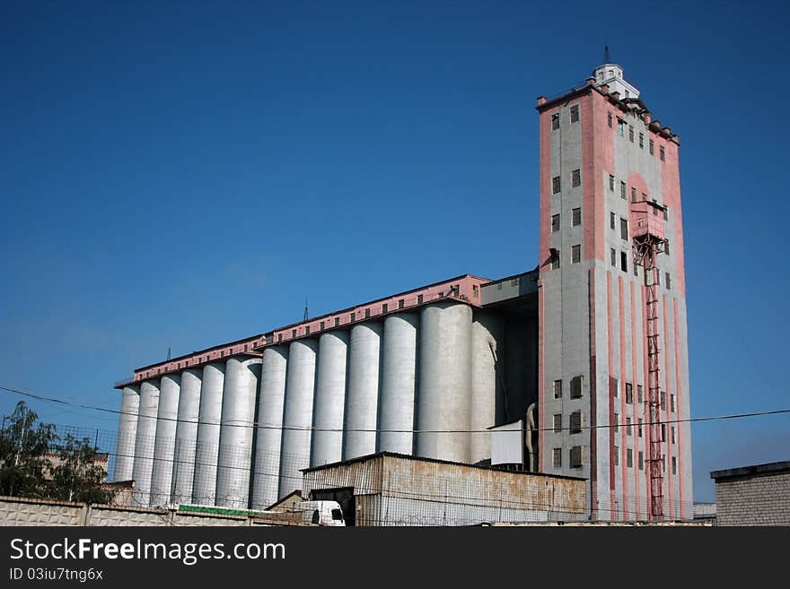 Structure of a factory on manufacture of bread on a background of the dark blue sky