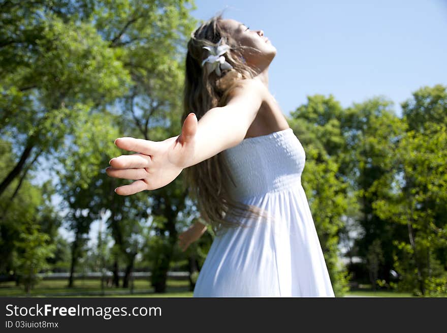 Portrait of the young woman in park. Portrait of the young woman in park