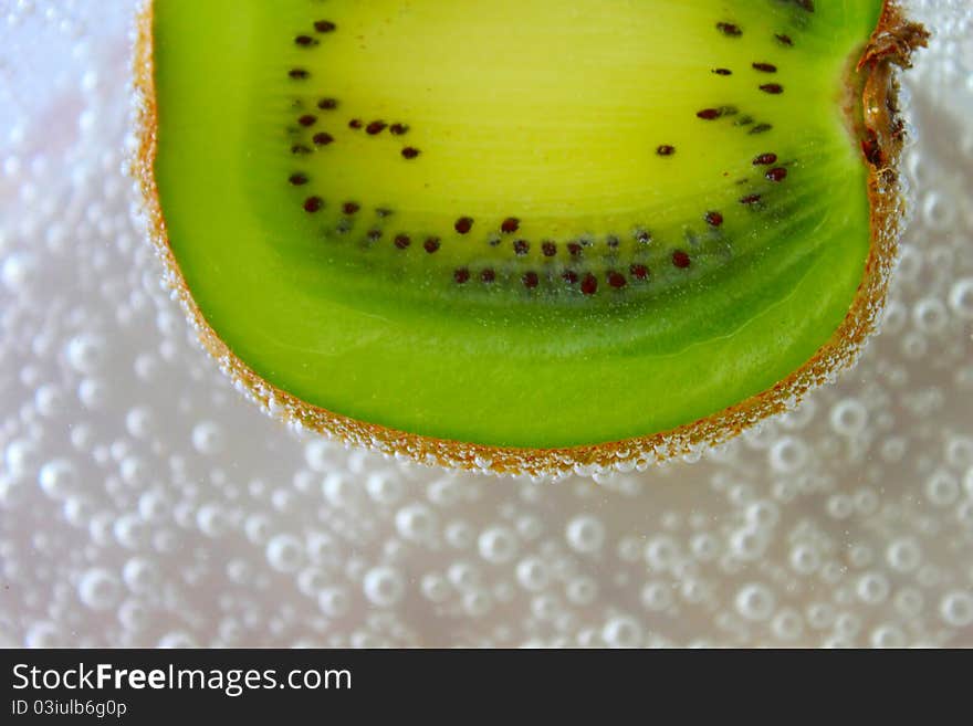 Fresh slice of kiwi in soda. Fresh slice of kiwi in soda