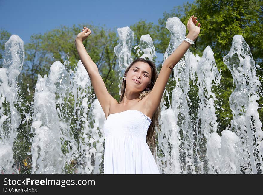 Young Woman Lifts Upwards Hands