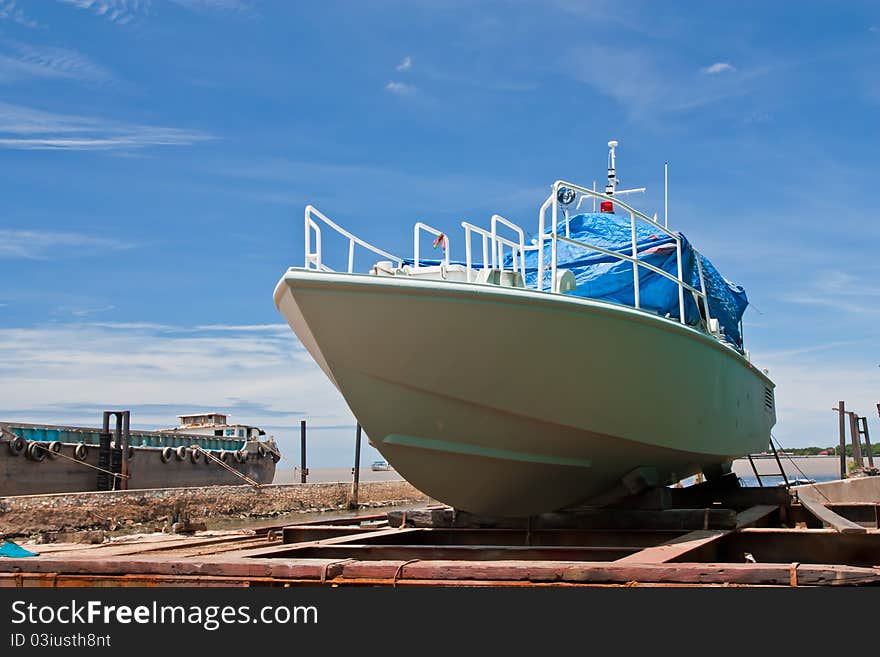 Painting a boat on the drydock