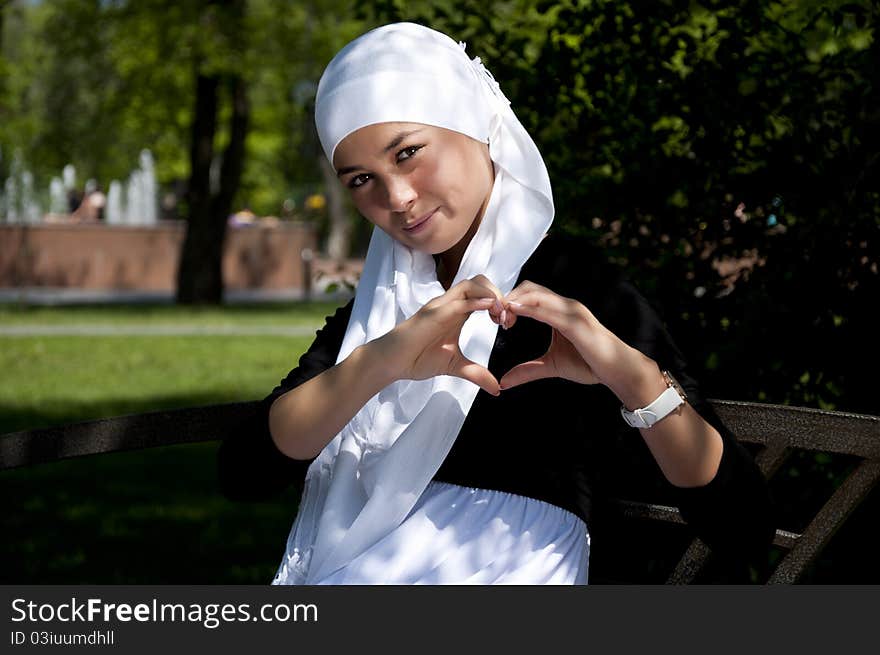 Portrait Of Young Woman In Park