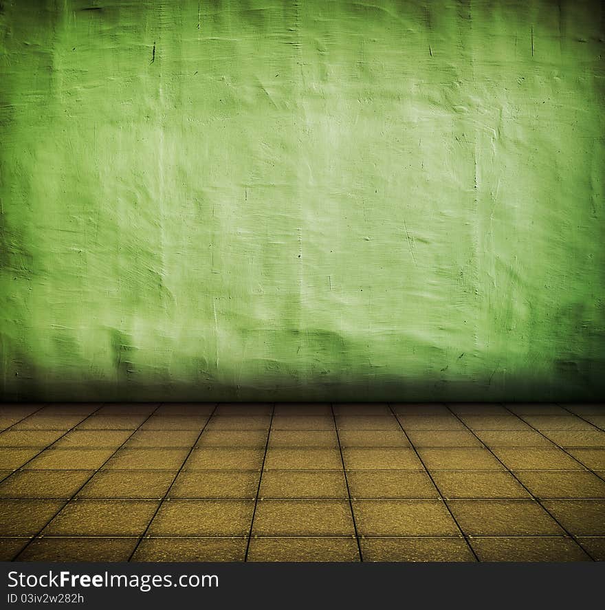 Grunge green industrial interior with tile floor with artistic shadows added and focus set on the wall. Grunge green industrial interior with tile floor with artistic shadows added and focus set on the wall