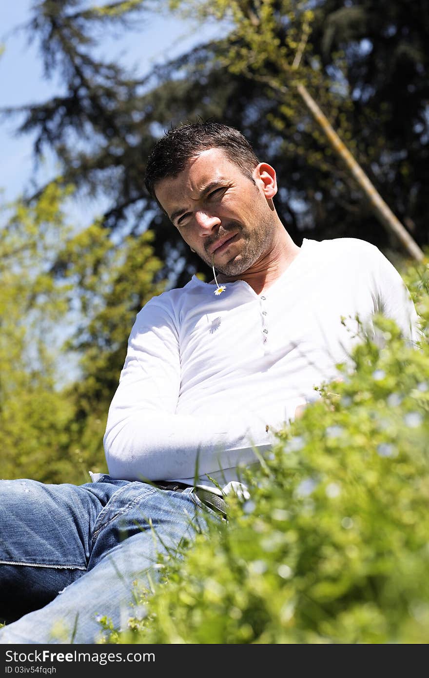 Young man on the grass in a park. Young man on the grass in a park