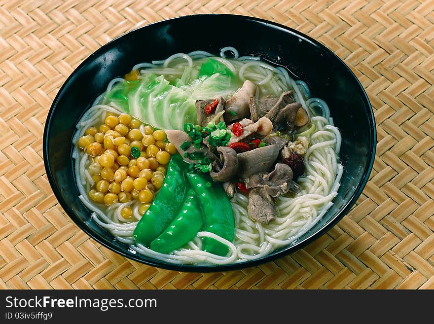 A traditional asian noodle soup with pork. A traditional asian noodle soup with pork