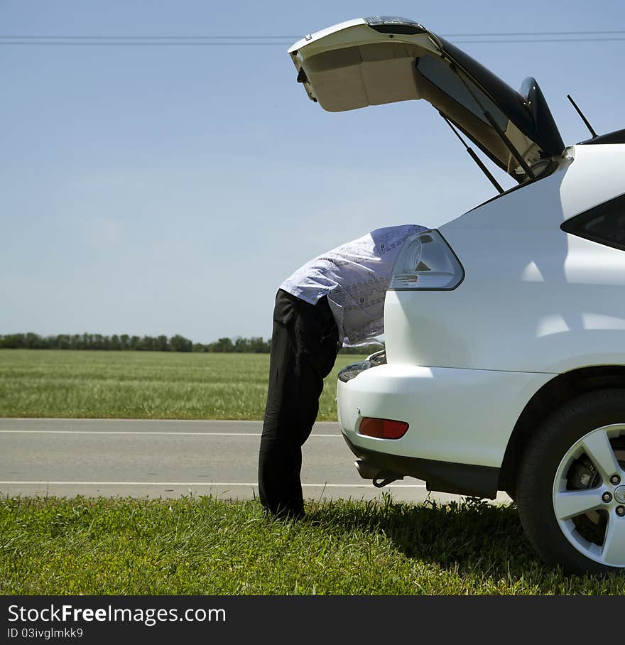 A man and a car on the road