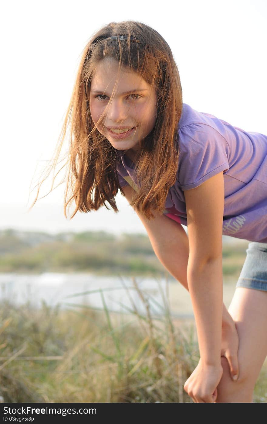 Young girl posing at the beach