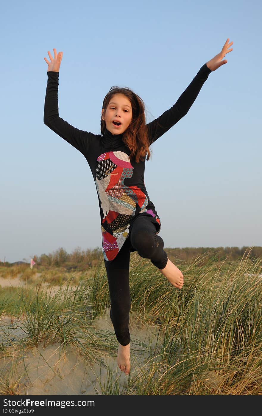 Young girl jumping for joy