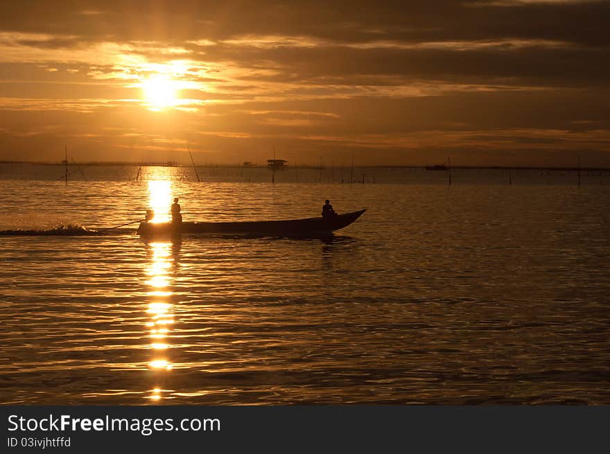 Fishermen boat in sunset