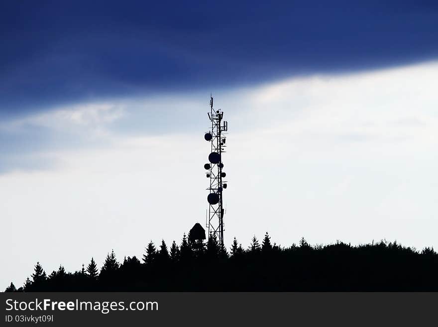 Radio antena over sunset background