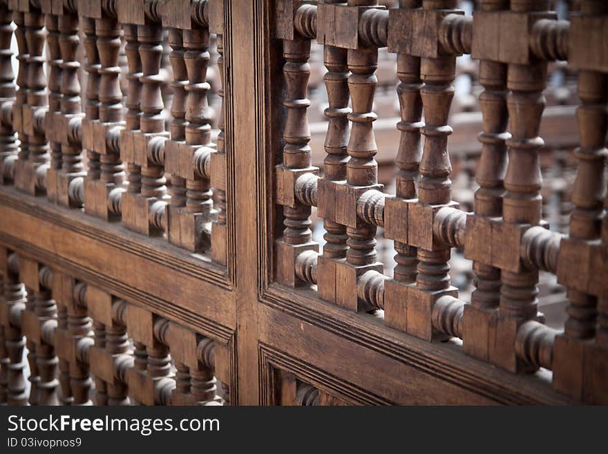 A detail of the railing on the first floow of the Medersa Ben Youssef, the beautiful Quran School located in the heart of Marrakesh, Morocco. A detail of the railing on the first floow of the Medersa Ben Youssef, the beautiful Quran School located in the heart of Marrakesh, Morocco