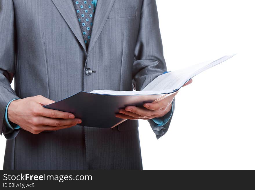 Elegant businessman is holding folders with paperwork isolated on white. Elegant businessman is holding folders with paperwork isolated on white