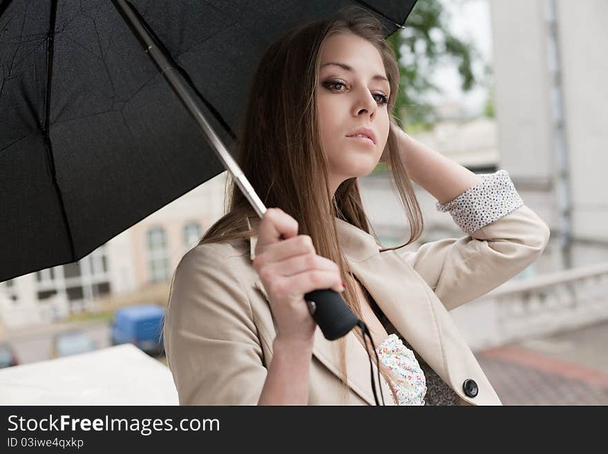 A beautiful woman posing at the street. A beautiful woman posing at the street