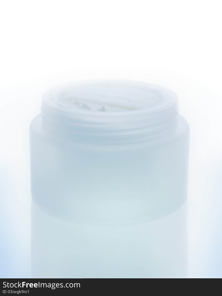 Cream for skin care in a saturated jar isolated on a white background. Cream for skin care in a saturated jar isolated on a white background