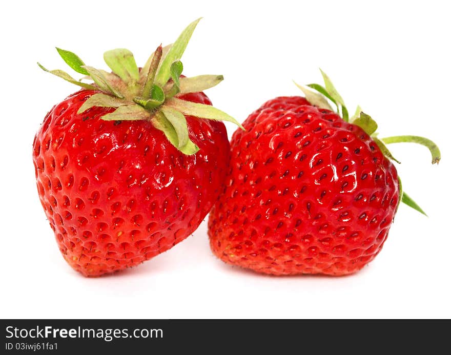 Two ripe strawberries on the white background