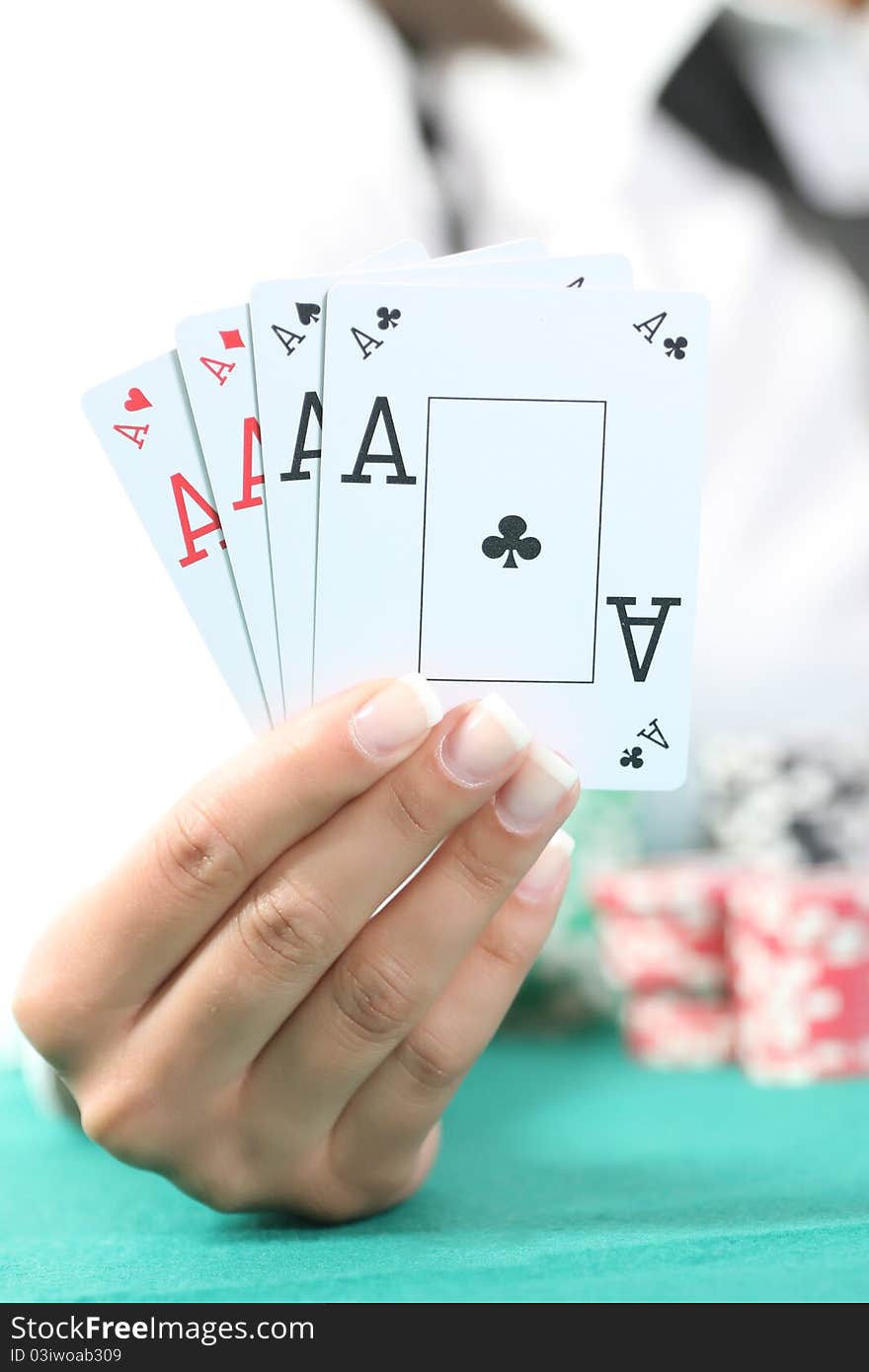 Female hand hold the four aces isolated in studio. Female hand hold the four aces isolated in studio