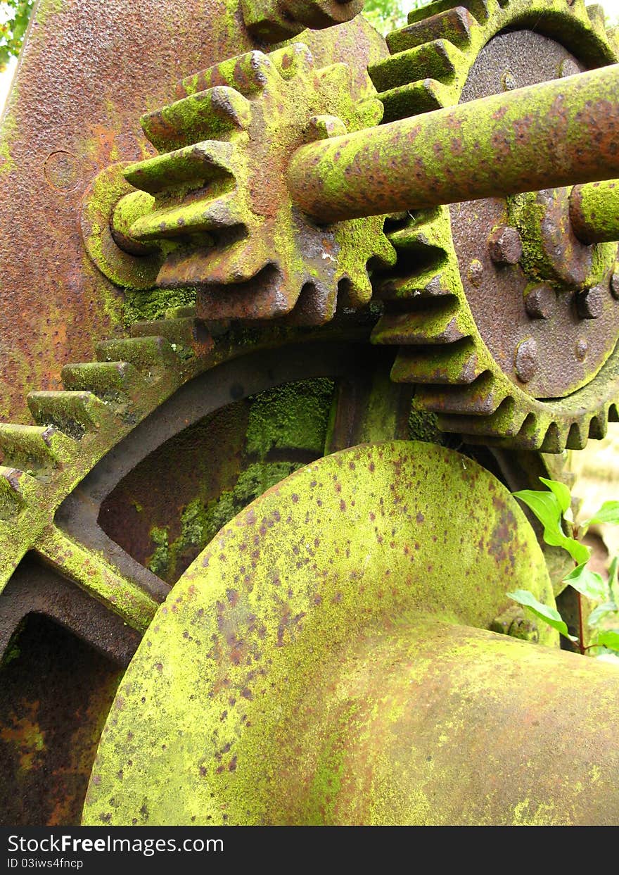 Old moss covered machinery closeup. Old moss covered machinery closeup