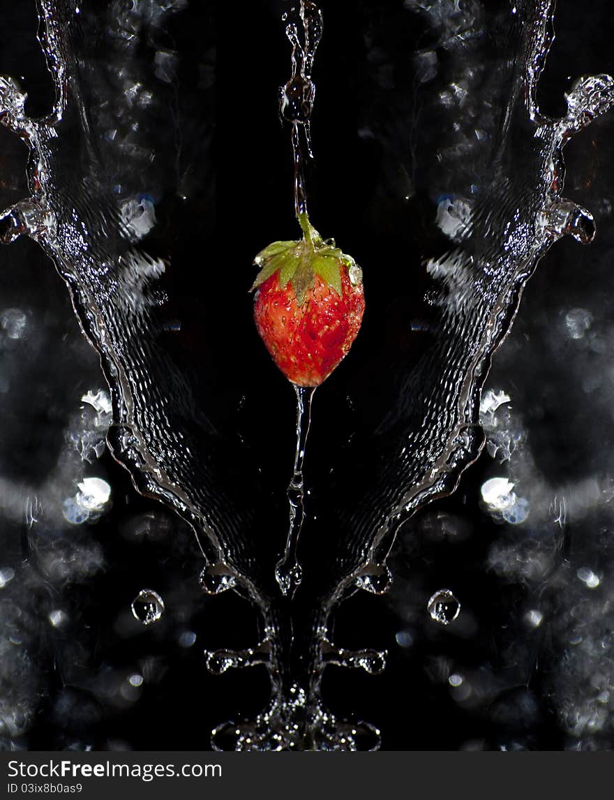 Juicy strawberry over water splashes