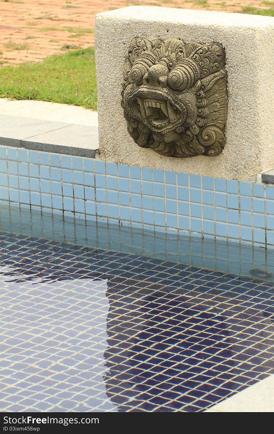 Lion statue pool in the garden