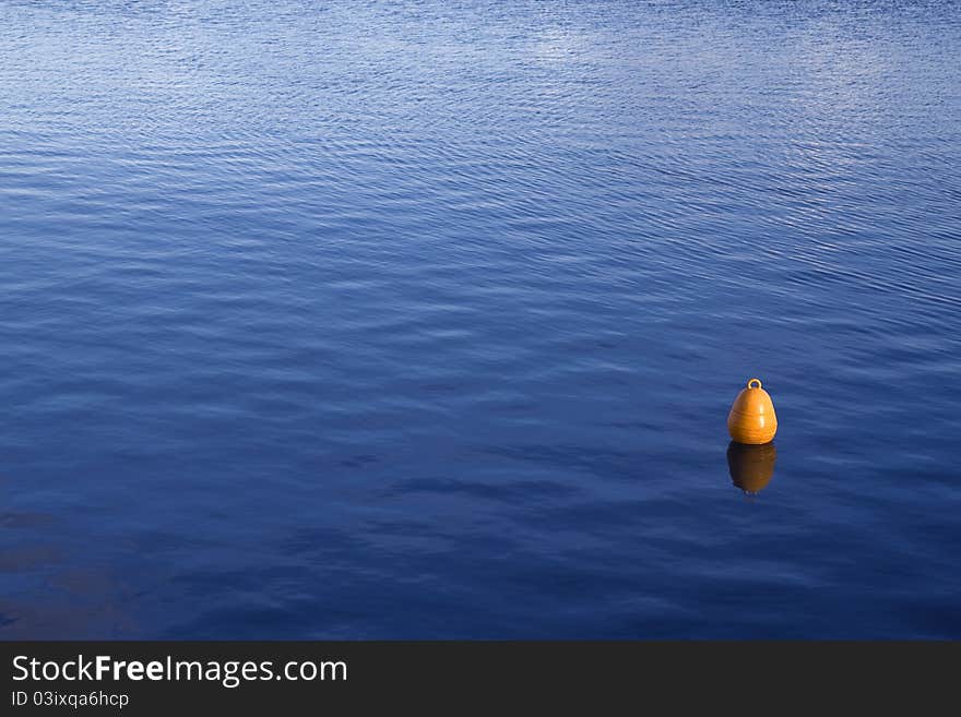 A yellow buoy in the sea