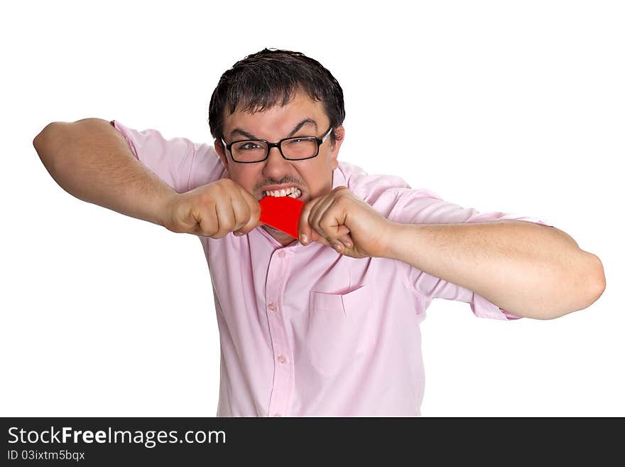 A young man with a credit card poses on a white background